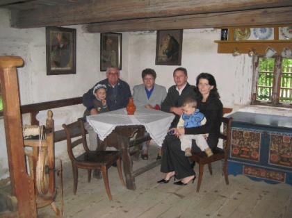 Patryk, Louis, Maria, Valdemar, Ania, and Marcel Welna all sitting at Valentine Welna&rsquo;s kitchen table.