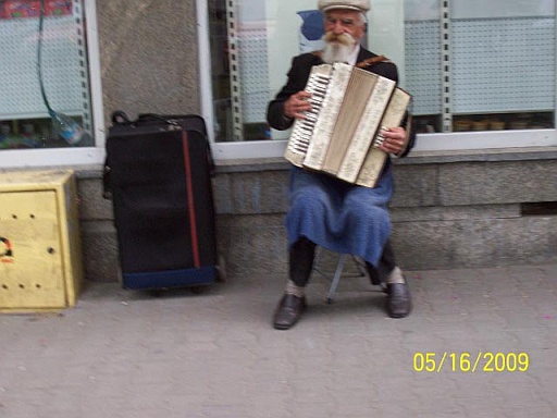 An accordion player on a Warsaw street
